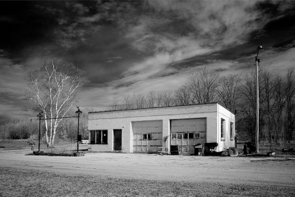 Old gas station along the road in rural upperstate Michigan - In