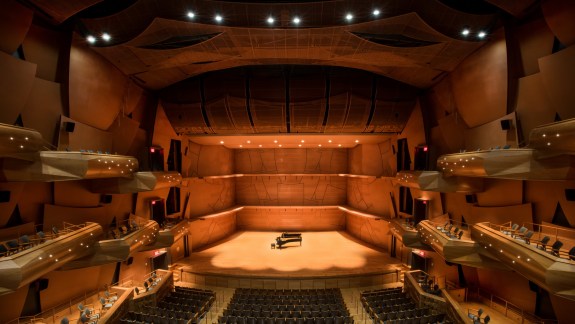 Musco Center's Women of Chapmen stage with piano and orchestra shell. Credit: Doug Gifford.